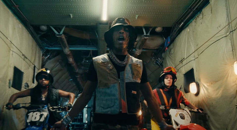 Lil Baby Rocks AlphaStyle’s Upcycled Utility Vest in “Squad Up” Commercial